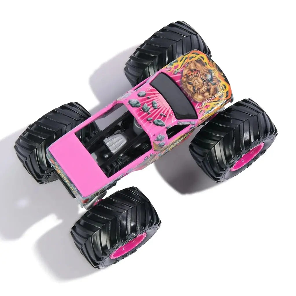 Top view of Monster Jam Stone Crusher 1:64 scale toy truck in pink with lion artwork, bold flames, textured black tires, and pink rims highlighting collectible Danger Divas edition design.