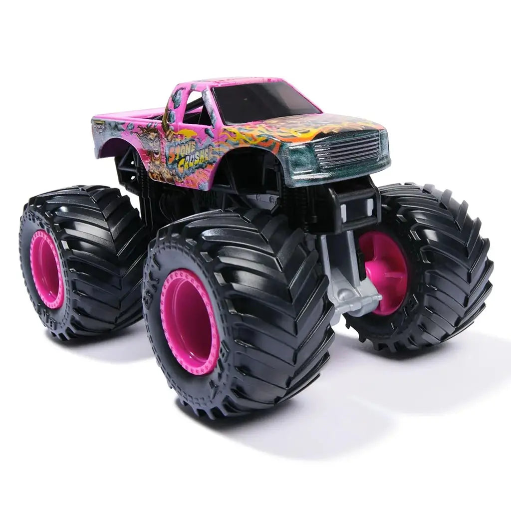 Front angled view of Monster Jam Stone Crusher toy truck in pink with flame graphics, oversized treaded wheels, and bold Stone Crusher branding on sides for collectors and kids’ play.