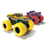 Monster Jam Wolverine toy truck in yellow and teal painted metal with black stripe accents, oversized rubber tires, lifted suspension frame, detailed pickup body, displayed on a clean white background.