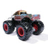 Rear angled view of Monster Jam Zombie diecast toy truck with distressed paint effect, raised zombie hands, chunky black tires, and bright red rims designed for kids’ imaginative play.