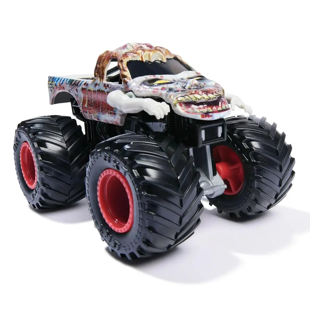 Monster Jam Zombie toy truck angled front view showing oversized wheels, red hubs, zombie face on hood, bloody paint effects, and raised arms for a spooky monster truck display piece.