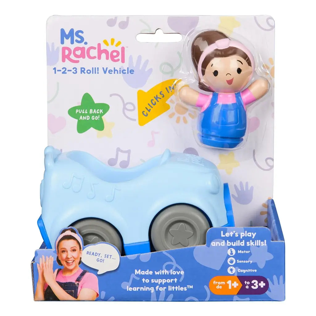 Ms. Rachel 1-2-3 Roll vehicle toddler toy in soft blue plastic with gray wheels and removable girl figure, rounded car shape with music note details, pull-back learning car displayed in retail packaging against a pastel pattern background.