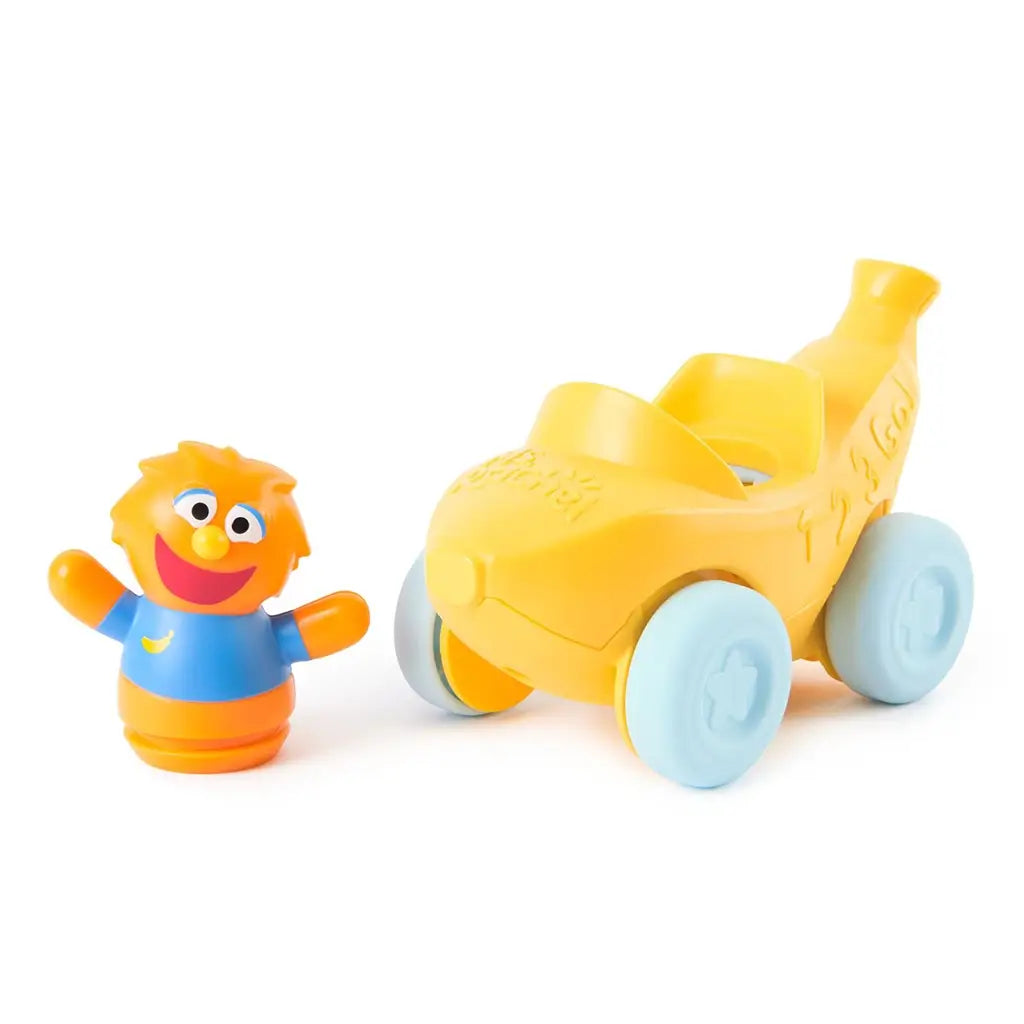 Ms. Rachel Herbie’s 1-2-3 Roll vehicle toy in bright yellow plastic with soft blue wheels, rounded front nose and separate orange smiling figure, pull-back toddler learning car displayed on a clean white background.