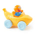 Ms. Rachel Herbie’s 1-2-3 Roll vehicle toddler toy in smooth yellow plastic with soft blue wheels, curved banana-shaped car and orange smiling character, pull-back learning car isolated on a clean white background.