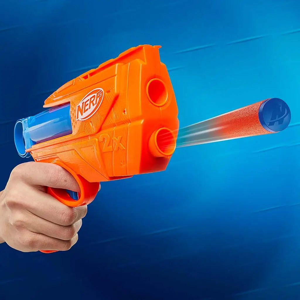 NERF foam dart blaster displays bold orange body and blue barrel as a dart launches forward, highlighting fast toy performance against a blue motion-blur background for action-focused presentation. Described in clear detail for accessibility and user understanding.