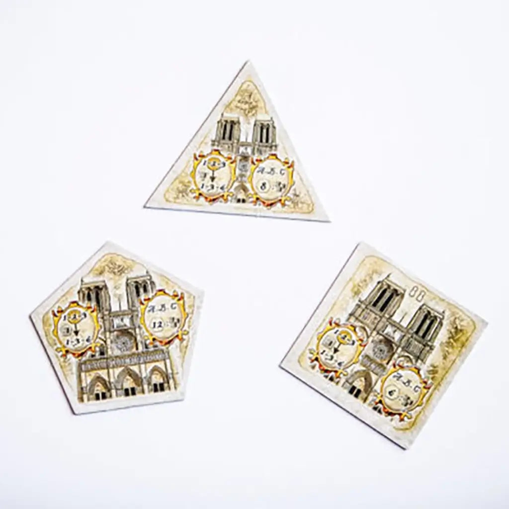 Notre Dame 10th Anniversary Edition player boards shaped as polygons with cathedral illustrations, scoring areas, and ornate designs printed in muted parchment colors.
