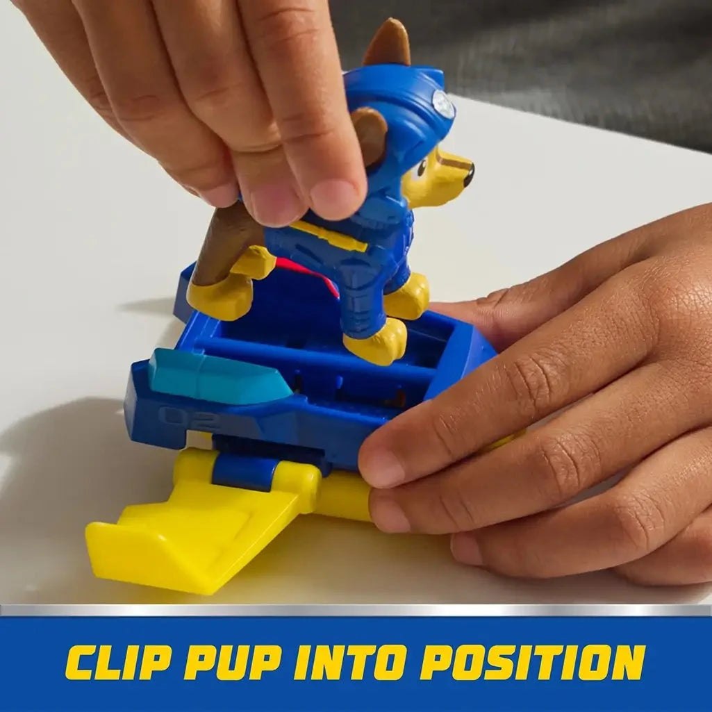 Hands clip PAW Patrol Chase action figure into blue hoverboard with yellow wings, highlighting secure attachment for stable and fun play.