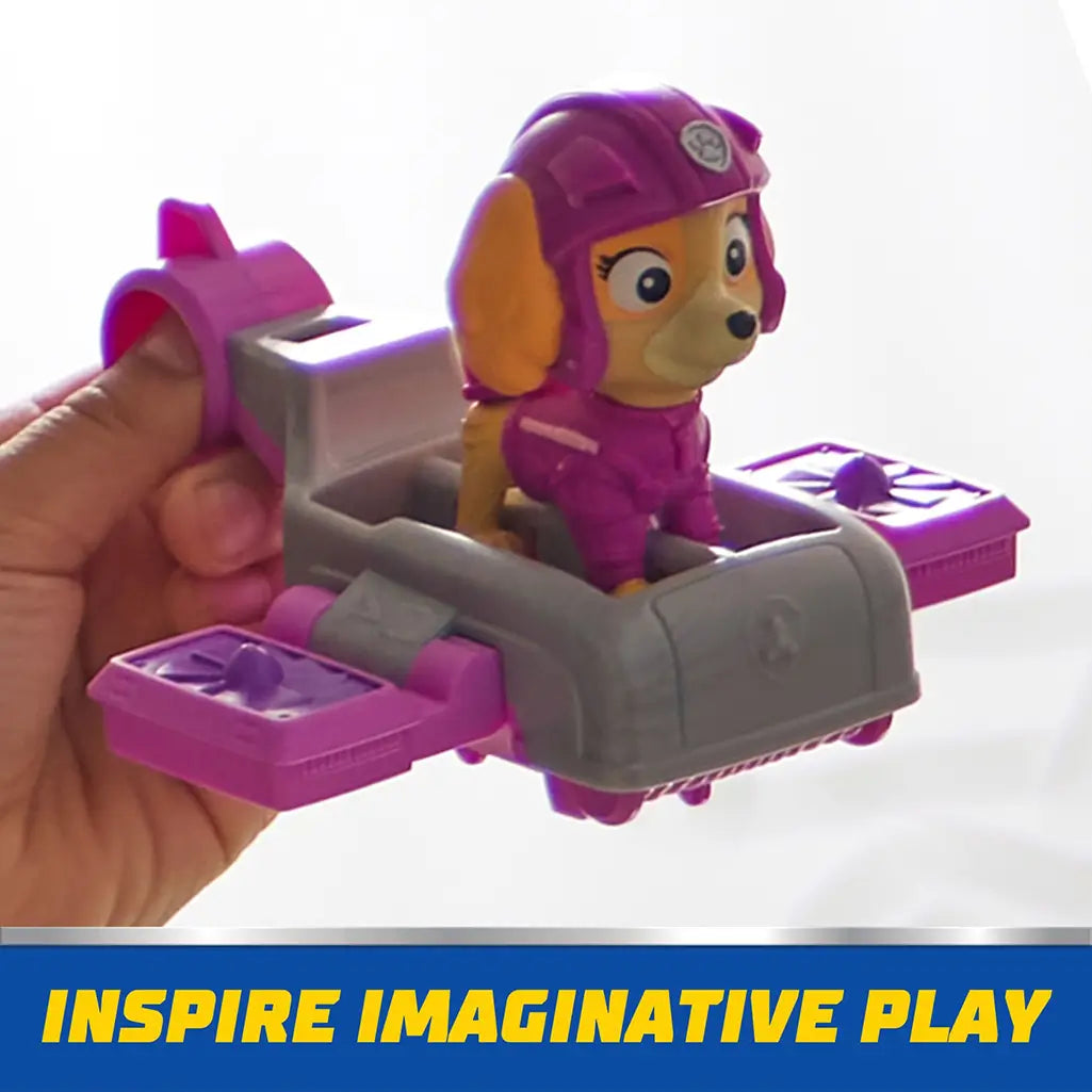 Child holds PAW Patrol Skye figure seated in gray and pink hoverboard, showcasing interactive design that inspires imaginative rescue missions.