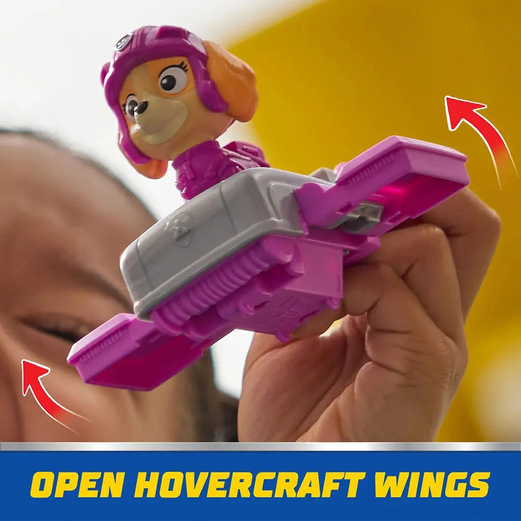 Child lifts PAW Patrol Skye toy in hoverboard with pink wings open, showcasing interactive flying mode for imaginative storytelling play.