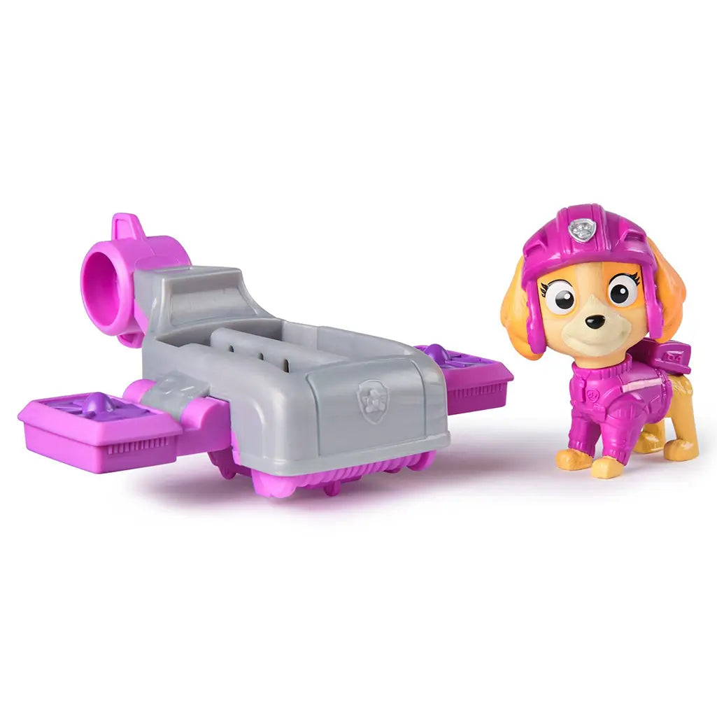PAW Patrol Skye figure in pink flight suit displayed beside gray and pink hoverboard, highlighting separate toy components designed for preschool adventure play.