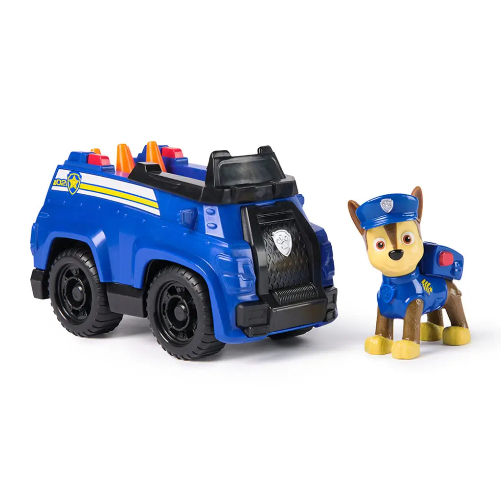 Paw Patrol Chase police cruiser sustainable toy vehicle with Chase figure standing beside blue cruiser, detailed with black wheels, safety cones, and police badge emblem.