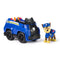 Paw Patrol Chase police cruiser sustainable toy vehicle with Chase figure standing beside blue cruiser, detailed with black wheels, safety cones, and police badge emblem.
