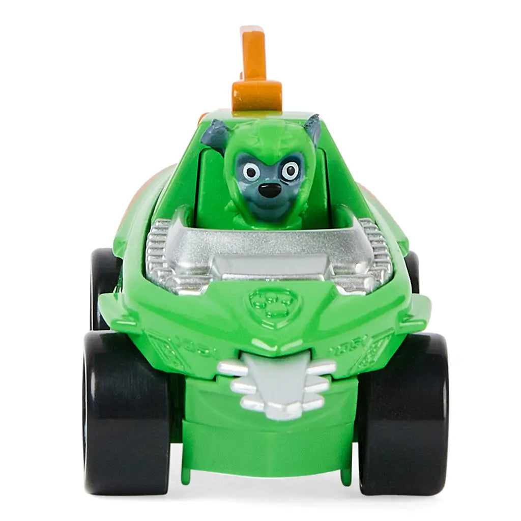 Green die-cast Paw Patrol Rocky Aqua Pups vehicle with smooth plastic finish, rounded front shape, character driver visible, and black wheels facing forward on a white background.