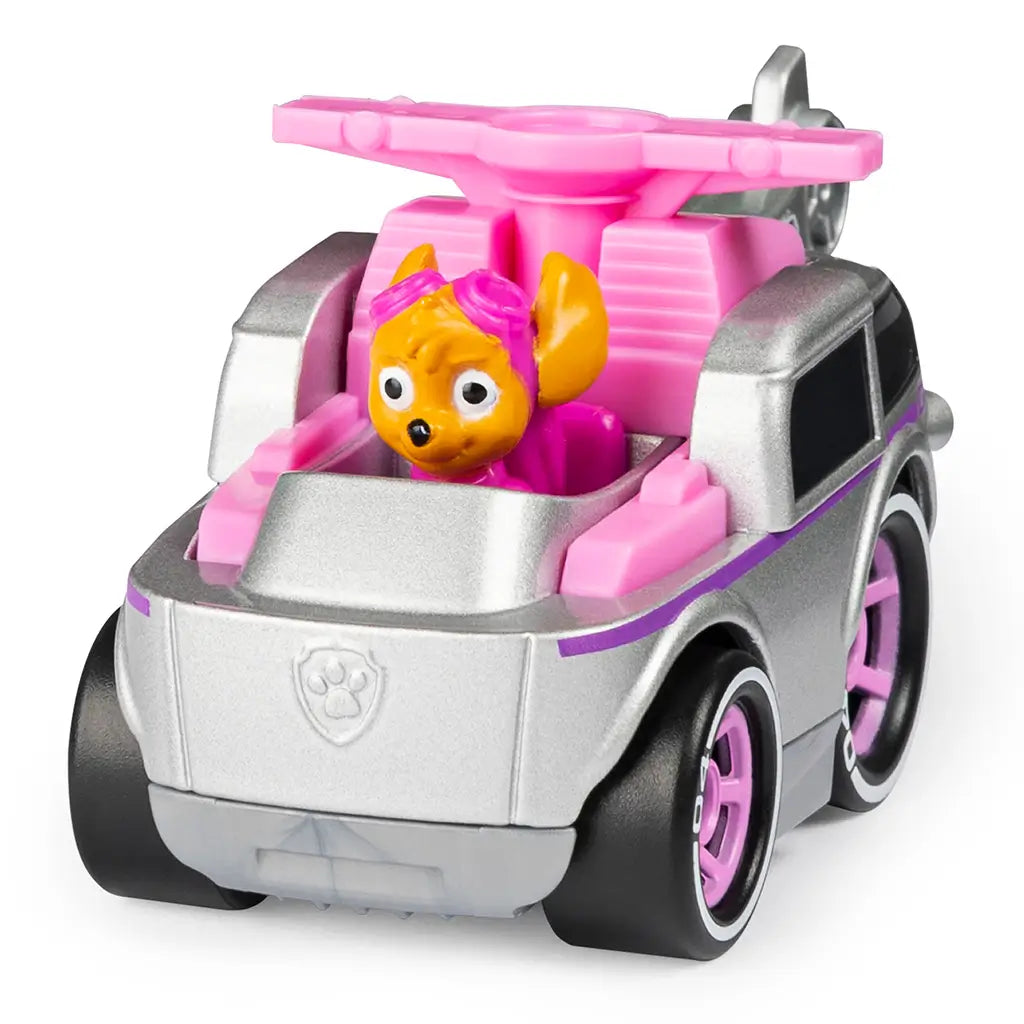 PAW Patrol Skye toy car in pink and silver metal finish, rounded compact shape with top rotor and character driver, designed for kids rescue adventures, displayed in angled studio view on a plain white backdrop