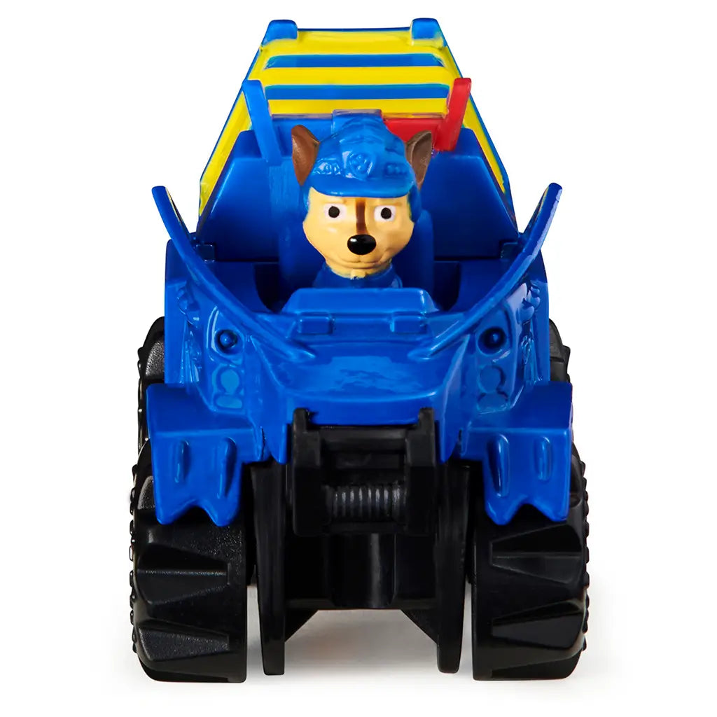 Blue die-cast Paw Patrol Chase Dino Rescue truck with smooth plastic body, wide front shape, visible character driver, and large black wheels facing forward on white background.
