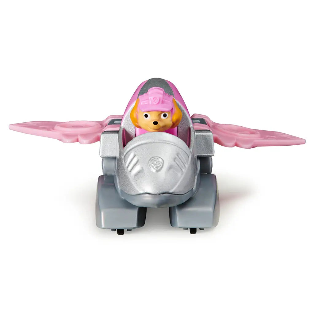 Paw Patrol Skye Dino Rescue toy vehicle in pink and silver plastic with smooth metallic texture, compact jet-shaped car form with wings and character figure, front view on a clean white background.