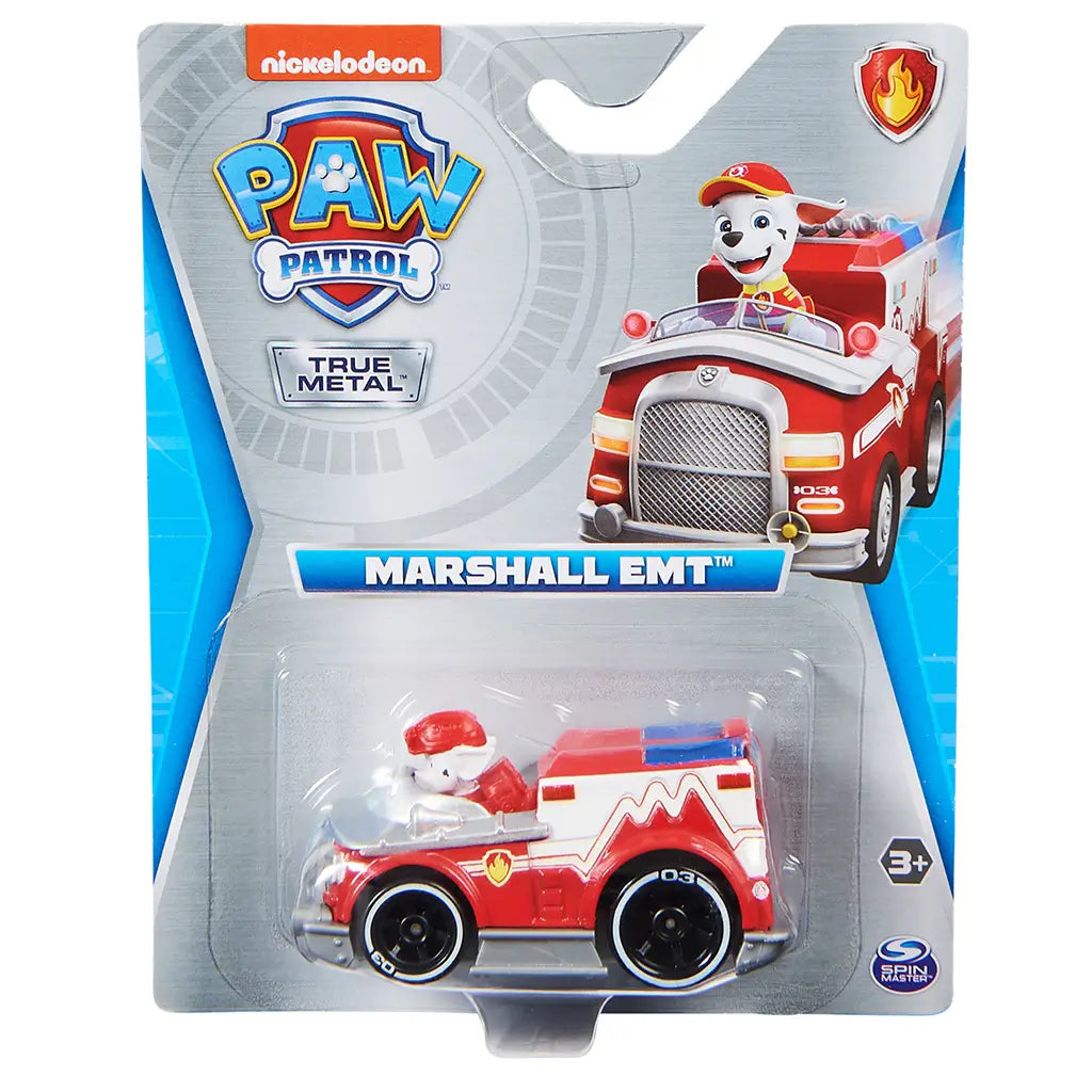 Red die-cast Paw Patrol Marshall EMT fire truck toy in clear plastic blister packaging on gray Nickelodeon card, featuring character art, bold logo, and age label on a retail display.