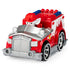 Red die-cast Paw Patrol Marshall EMT fire truck with silver grille, black wheels, and molded details, compact rescue vehicle design shown at an angled view on a plain white background.