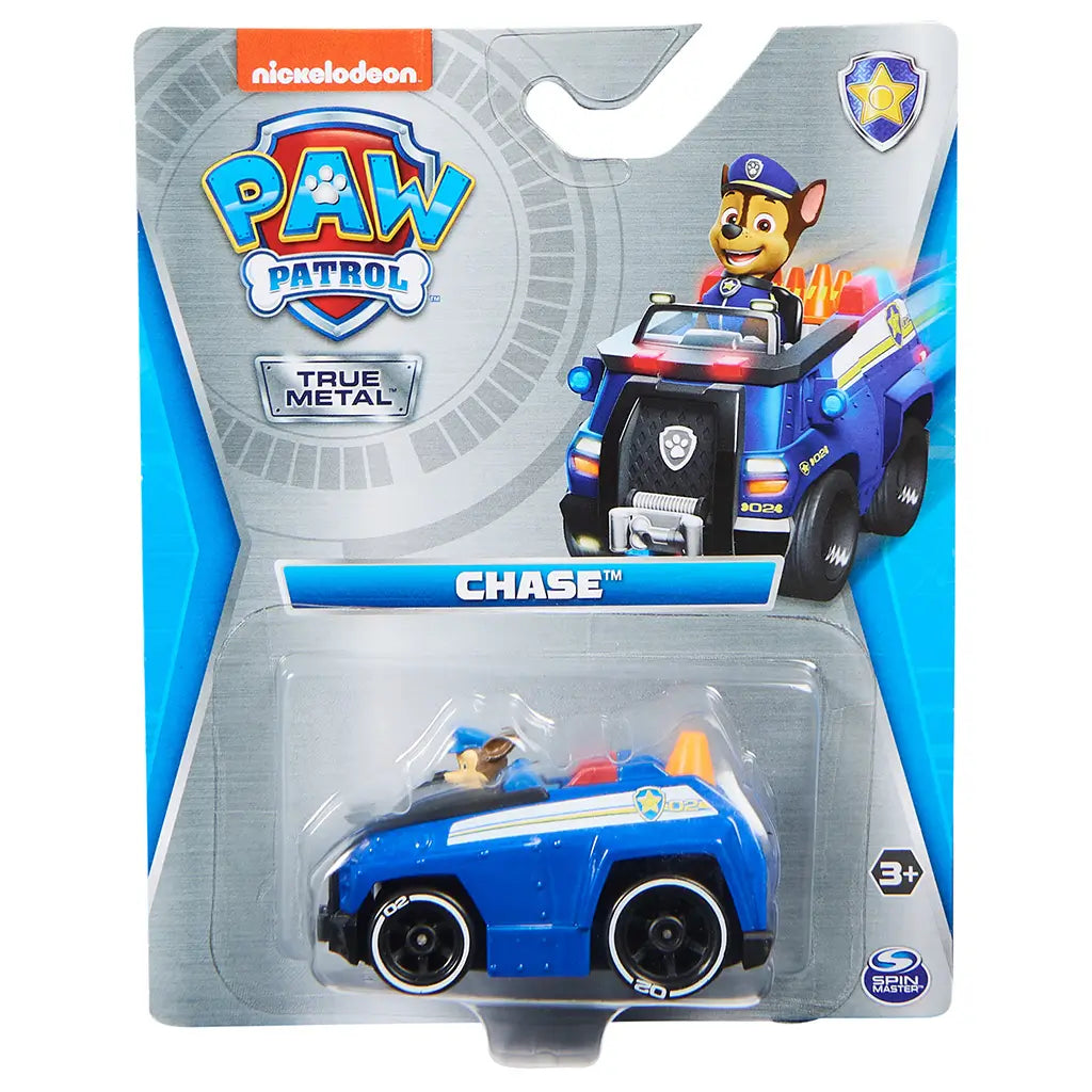 Blue metal Paw Patrol Chase police truck toy in plastic blister packaging with Nickelodeon branding, character image, bold logo, and safety labels on a gray and blue cardboard backing.