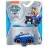Blue metal Paw Patrol Chase police truck toy in plastic blister packaging with Nickelodeon branding, character image, bold logo, and safety labels on a gray and blue cardboard backing.