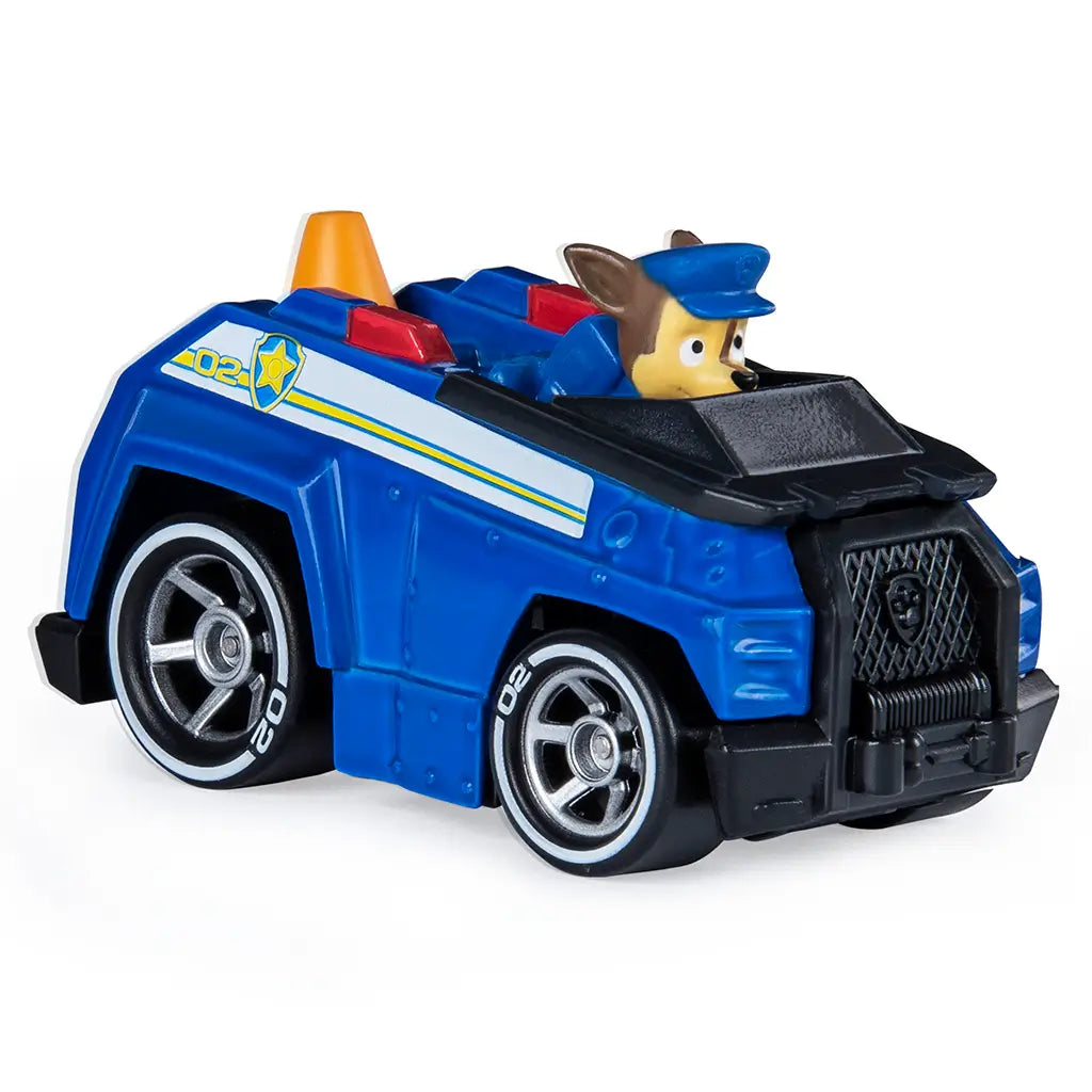 Blue die-cast Paw Patrol Chase police truck with black plastic grille, silver wheels, and orange cone detail, compact rescue vehicle design displayed on a clean white background.
