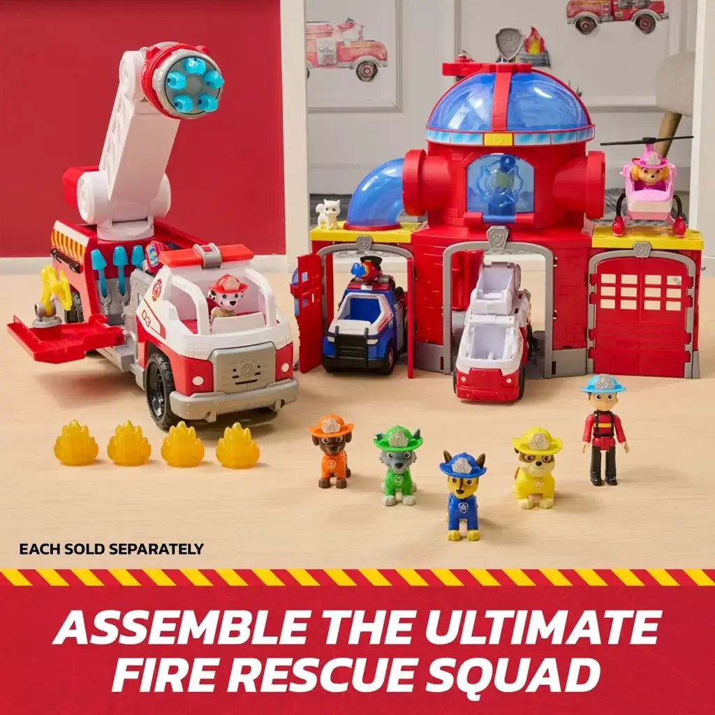PAW Patrol fire rescue headquarters playset in red and blue molded plastic with dome roof, garage doors, rescue vehicles, character figures, and flame accessories arranged on a wooden surface.