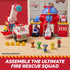PAW Patrol fire rescue headquarters playset in red and blue molded plastic with dome roof, garage doors, rescue vehicles, character figures, and flame accessories arranged on a wooden surface.