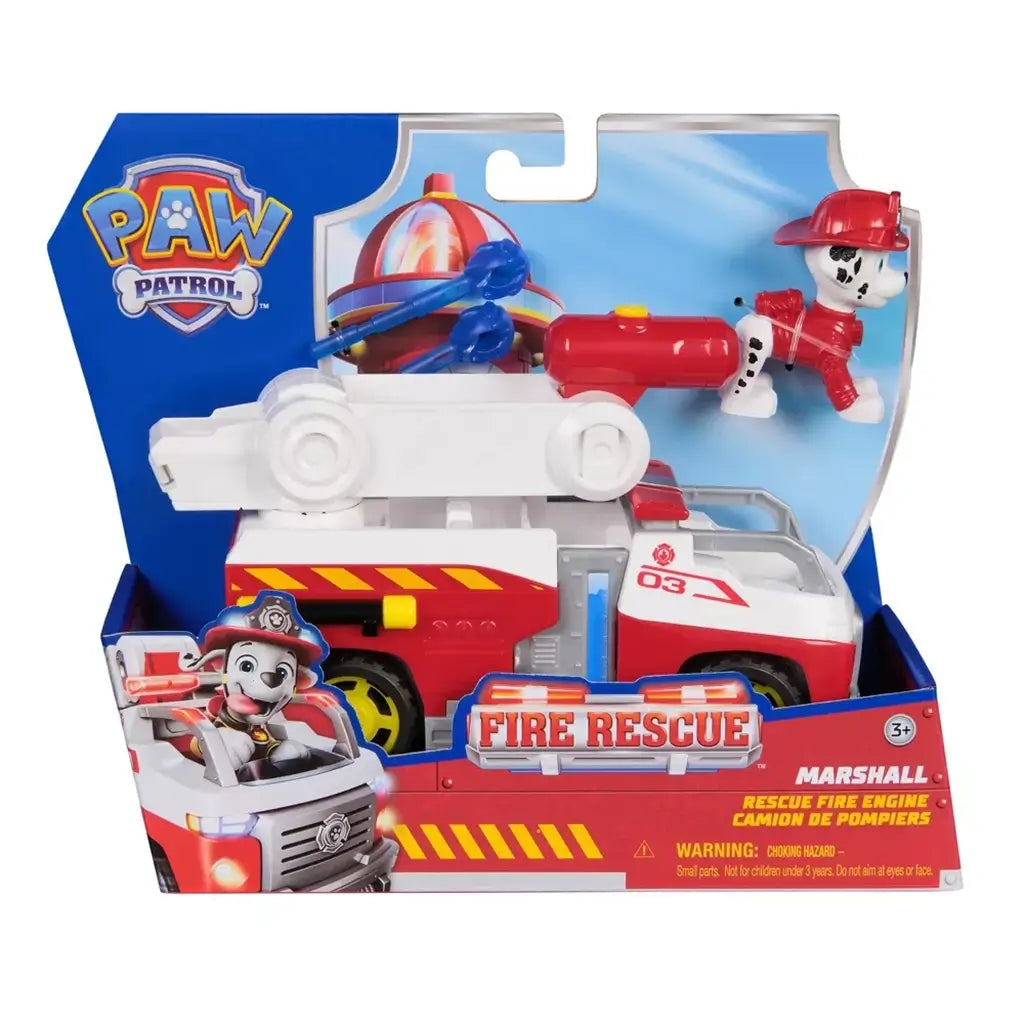 PAW Patrol Marshall rescue fire engine toy packaged in blue branded box with clear display window, showing red and white truck, Dalmatian figure, ladder launcher, and accessory projectiles inside.