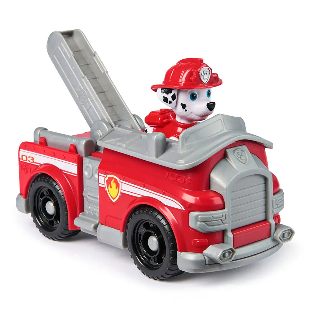Angled view of Paw Patrol Marshall fire engine toy with Marshall pup figure inside, showcasing gray ladder and fire truck details.