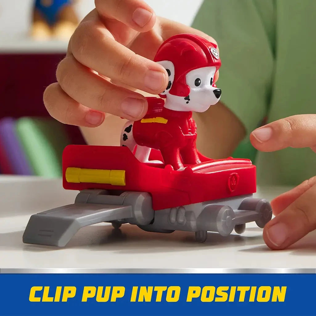 Child clips PAW Patrol Marshall figure into red hoverboard with gray details, demonstrating easy assembly and imaginative roleplay for young fans.