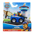Paw Patrol Chase Pup Squad Racers toy in blue plastic vehicle with silver wheels and brown character figure, packaged in colorful Nickelodeon retail box, displayed against illustrated Adventure Bay backdrop for retail shelf presentation
