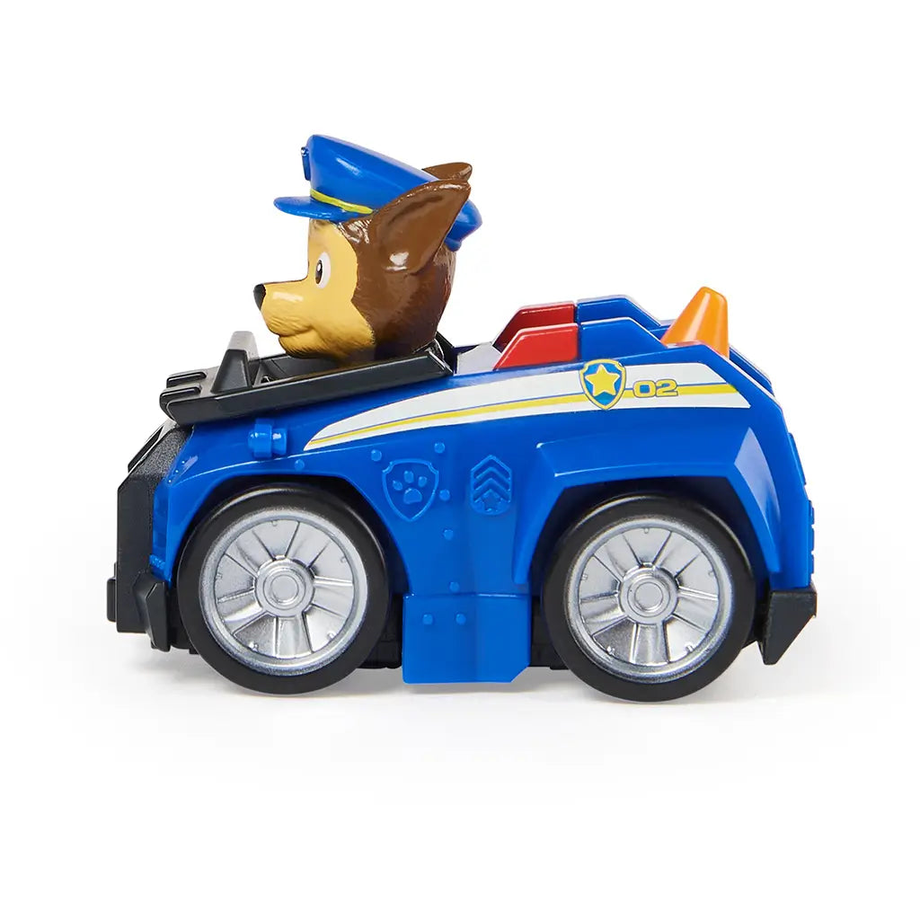 Paw Patrol Chase vehicle toy in blue molded plastic with silver wheels and black front grille, side profile showing compact racer form and police-themed details, isolated on a clean white background for product display