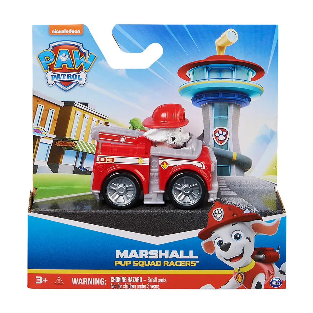 Paw Patrol Marshall Pup Squad Racers toy in red plastic fire truck with silver wheels and white Dalmatian figure, packaged in colorful Nickelodeon retail box, displayed against illustrated Adventure Bay backdrop for retail shelf presentation