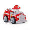 Paw Patrol Marshall racer toy in red plastic with glossy finish, silver wheels, and white Dalmatian character wearing red firefighter helmet, angled three-quarter view highlighting compact design, isolated on a white studio background