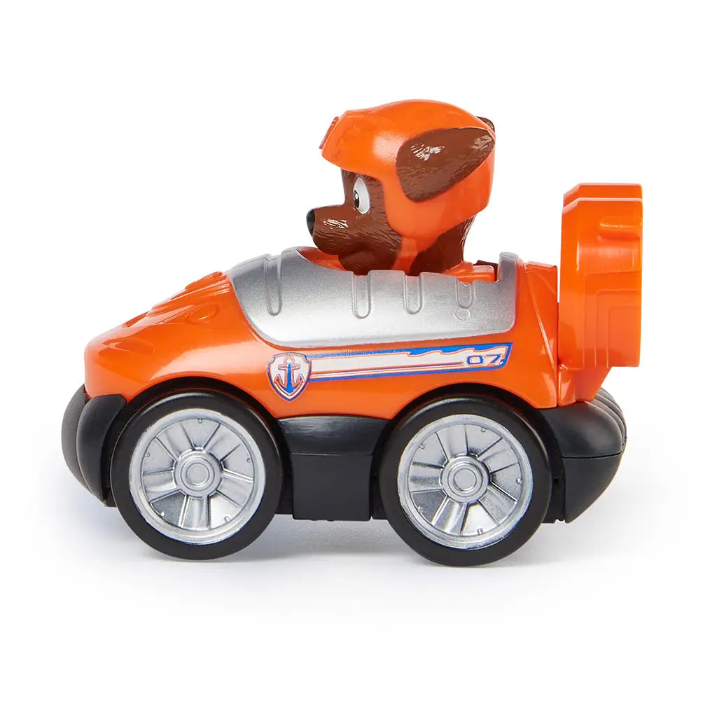 Paw Patrol Zuma vehicle toy in orange molded plastic with silver wheels and black base, side profile showing compact hovercraft racer form with water rescue details, isolated on a clean white background for product display