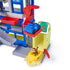 PAW Patrol Pup Squad Search and Rescue HQ playset in blue, gray, and red plastic with multi-level tower, curved ramp and launch platform, interactive rescue headquarters toy shown with vehicle and animal figure on a white background.
