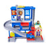 PAW Patrol Pup Squad Search and Rescue HQ playset in bright blue and gray plastic with red elevator and spiral ramp, multi-story rescue tower toy displayed with character figures and vehicle on a white background.