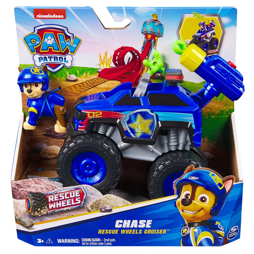 PAW Patrol Chase Rescue Wheels Cruiser blue plastic truck with oversized black wheels and yellow launcher displayed in retail packaging box with Nickelodeon branding and illustrated background.