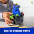 PAW Patrol toy truck blue plastic body with textured black oversized wheels and rear storage ports holding green projectiles, shown in child’s hands on tabletop in clean indoor play space.