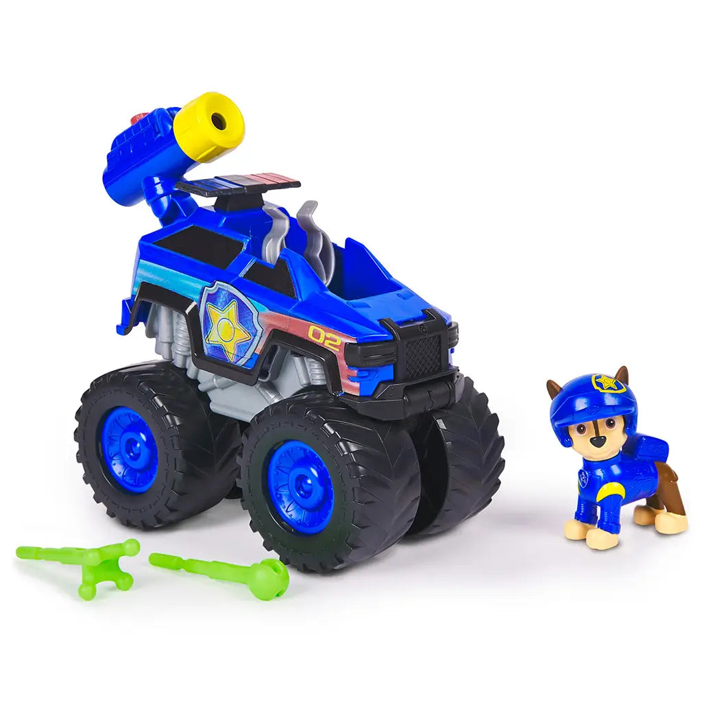 PAW Patrol toy truck blue plastic cruiser with black oversized wheels, yellow launcher and green accessories, alongside Chase figure, displayed on plain background emphasizing toy details.