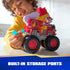 PAW Patrol Marshall fire truck toy features vivid red plastic body with flame graphics, built-in storage ports, oversized rugged wheels, and ladder attachment, used by child during imaginative indoor play activity.