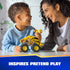PAW Patrol Rubble bulldozer toy shows bright yellow plastic vehicle with textured details and oversized wheels, used by a child and parent together, highlighting interactive pretend play in a home setting.