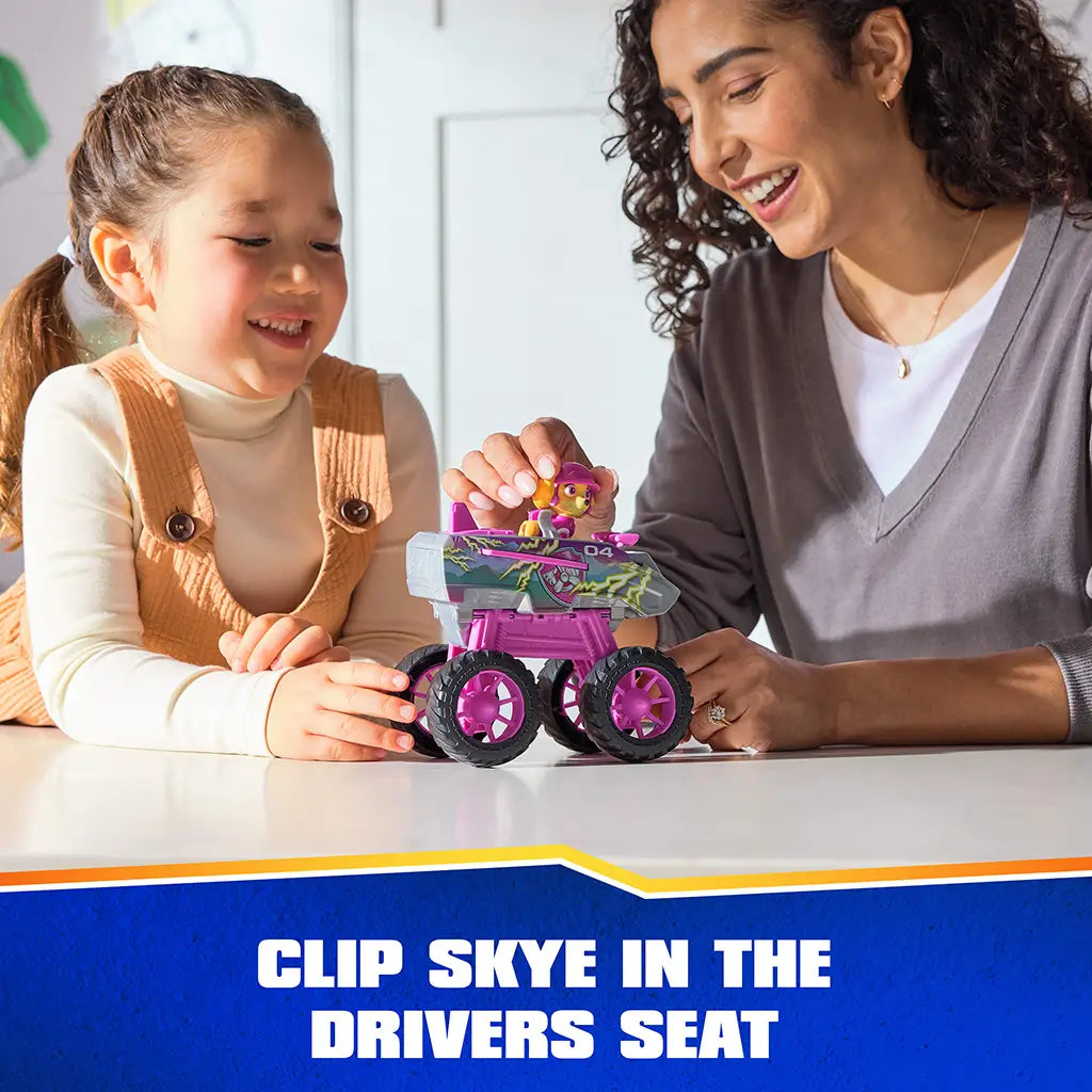PAW Patrol Skye jet toy includes pink and gray plastic vehicle with smooth texture, oversized wheels, and removable character figure seated in driver position during interactive play with adult guidance.