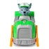 Front view of Paw Patrol Rocky recycle truck toy with gray grille, green hood, orange lift arms, and Rocky pup figure in green uniform seated inside cab.
