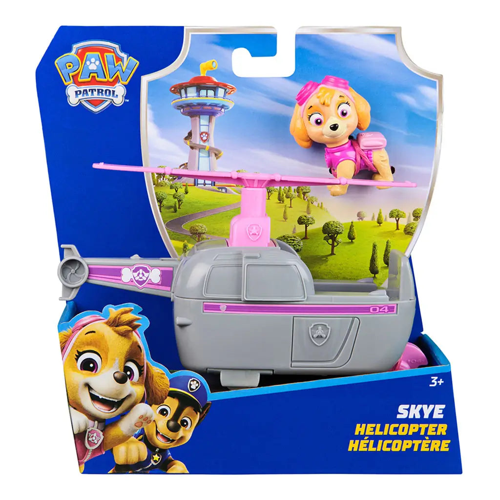 Paw Patrol Skye helicopter toy in retail packaging, featuring gray and pink helicopter with rotating blades and Skye pup figure in pink aviator goggles and vest.