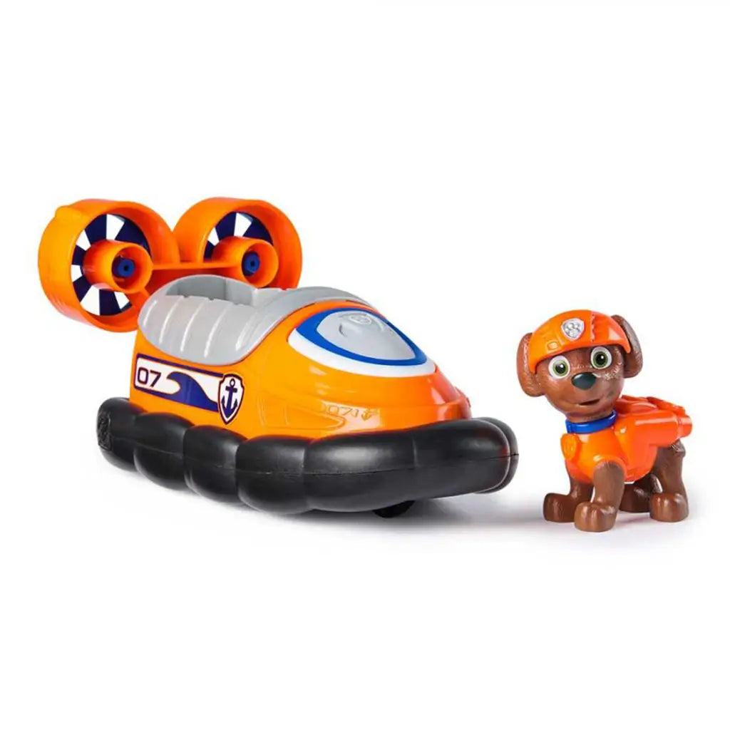 Paw Patrol Zuma hovercraft toy with detachable Zuma pup figure, showcasing bright orange vehicle body, black base, silver detailing, and dual propeller engines.