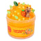 Bright orange icee slime with a textured, fizzy look, topped with a capybara figurine holding an orange, citrus slice confetti, and green leaf charms, packaged in a jar labeled Capybara Treats Icee Slime.