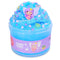 Bright blue cloud slime with a soft, fluffy texture, topped with purple fairy figure, glittery star and butterfly confetti, packaged in a clear jar labeled Fairy Dust for play.