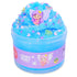 Bright blue cloud slime with a soft, fluffy texture, topped with purple fairy figure, glittery star and butterfly confetti, packaged in a clear jar labeled Fairy Dust for play.