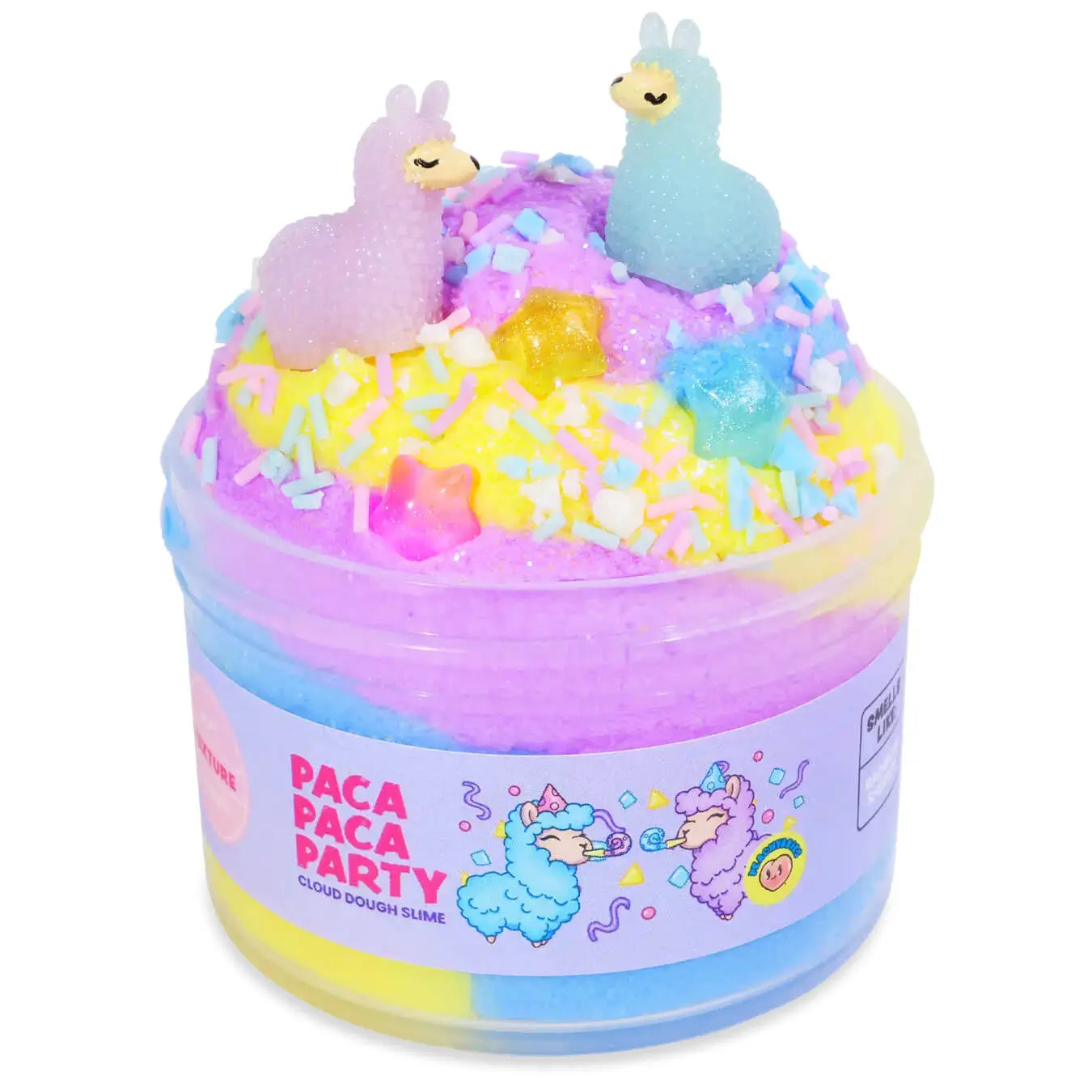 Colorful cloud dough slime in pastel blue, yellow, and purple, topped with two llama figurines, rainbow sprinkles, and glitter stars, packaged in a jar labeled Paca Paca Party.